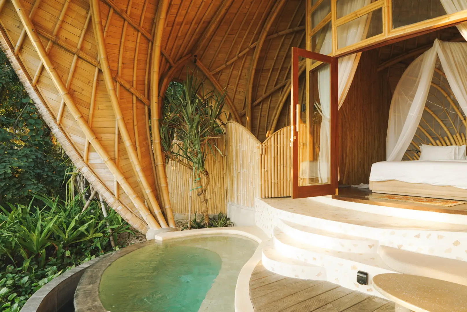 Wide view of Eco Bamboo Beach View lodge deck with jungle and ocean panorama — Kini Resort Sumbawa